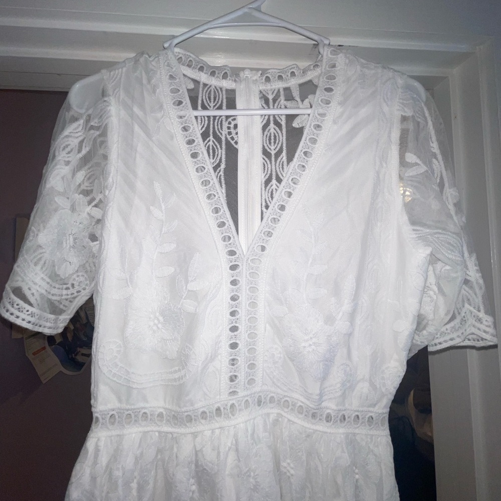 I’m not sure of the brand name, it’s a size small and it’s never been worn.